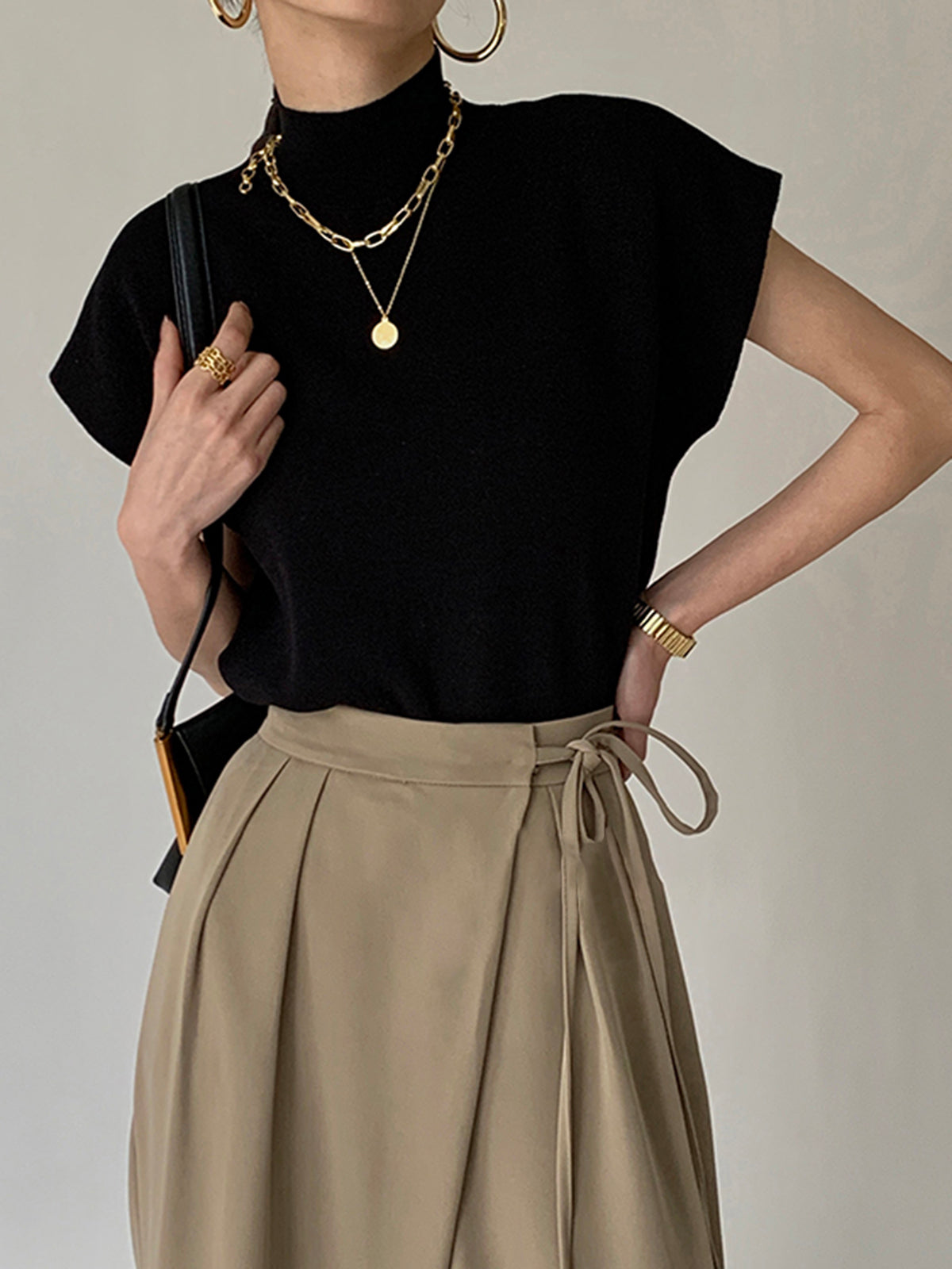 Chloe – Mouwloze Gebreide Top met Hoge Hals